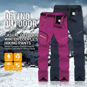 Single pack couples’ waterproof, wear‑resistant outdoor pants made from soft shell fabric with fleece lining for warmth, featuring zippered pockets; suitable for hiking, climbing, sports activities, and high‑level jogging.