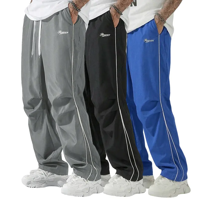 Men’s three-pack casual athletic long pants:  striped quick-dry paratrooper pants; high-street trendy loose straight-leg drawstring sweatpants  commuting sports/fitness training. Trouser Operator Pockets  Esports wear baggy clothes Wide Loose-Fit Pants, A