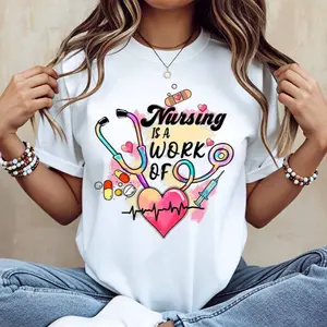 Nursing Is A Work Of Heart Stethoscope And Medical Symbols Print T Shirt White Casual Short Sleeve Top