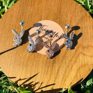 Gem playboy belly piercing