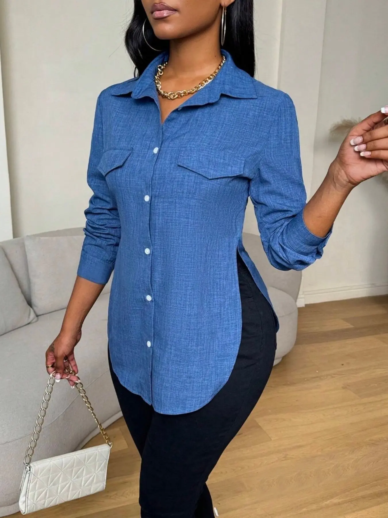 A ladies' blue Woven button-down shirt blouse top with a pocket decoration and long sleeves, Womenswear suitable for all kinds of Casual office wear.