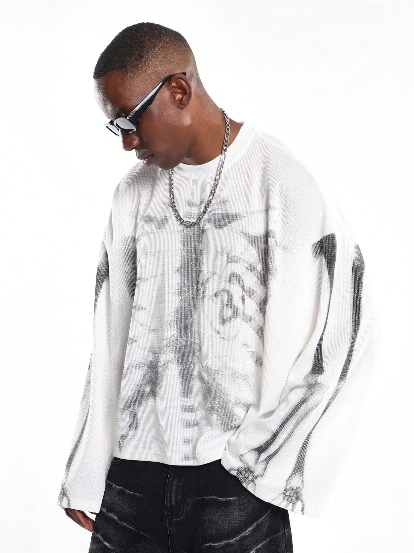 Men's white waffle-knit long-sleeve shirt, Knitwear, skeleton ribcage graphic print, oversized fit, crew neck, drop shoulders, streetwear style, edgy aesthetic, casual daily wear, urban fashion vibe, soft textured fabric