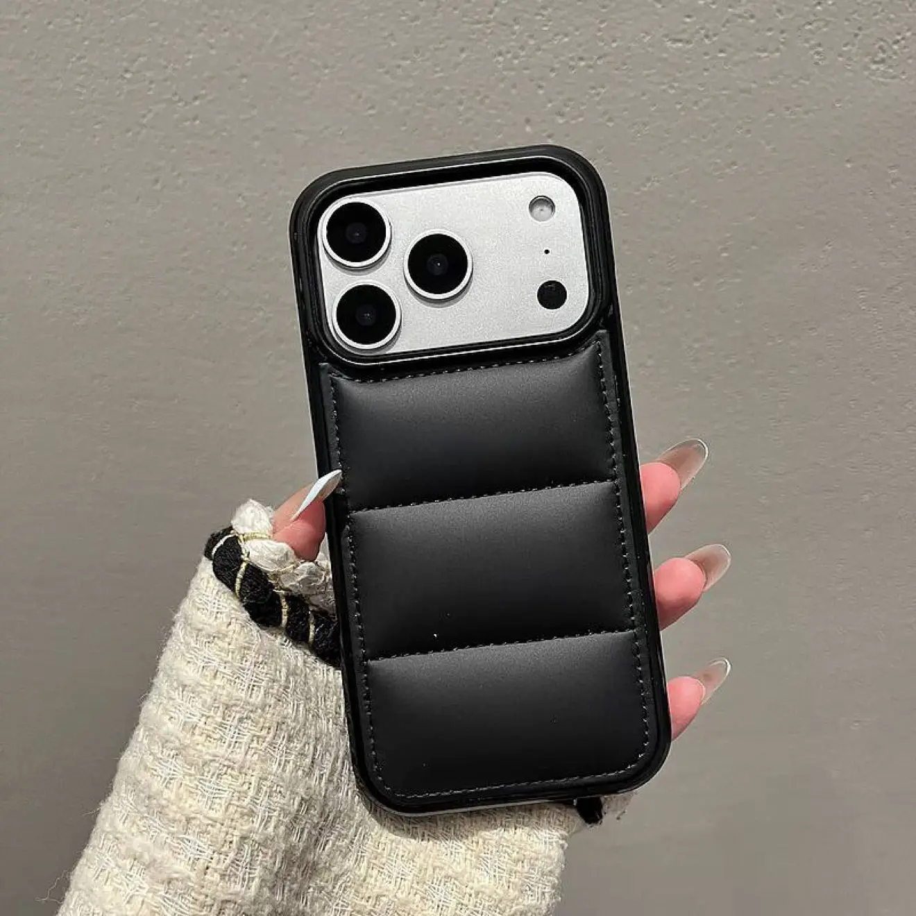 Stylish black down jacket-shaped phone case compatible with iPhone 16 15 14 13 12 11 Pro Max Pro Plus series Features a minimalist solid color design with drop protection and anti-slip grip for enhanced device safety Ultra-thin an