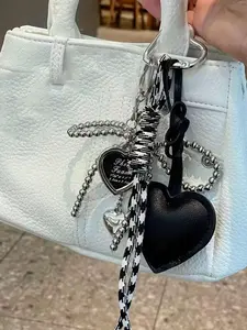 A personalized, exquisite love pendant decoration with a bow, designed with a woven hanging rope, can be used as a bag hanging accessory, keychain, Bag Charms, Purse Accessories, suitable for shopping, commuting, and gatherings