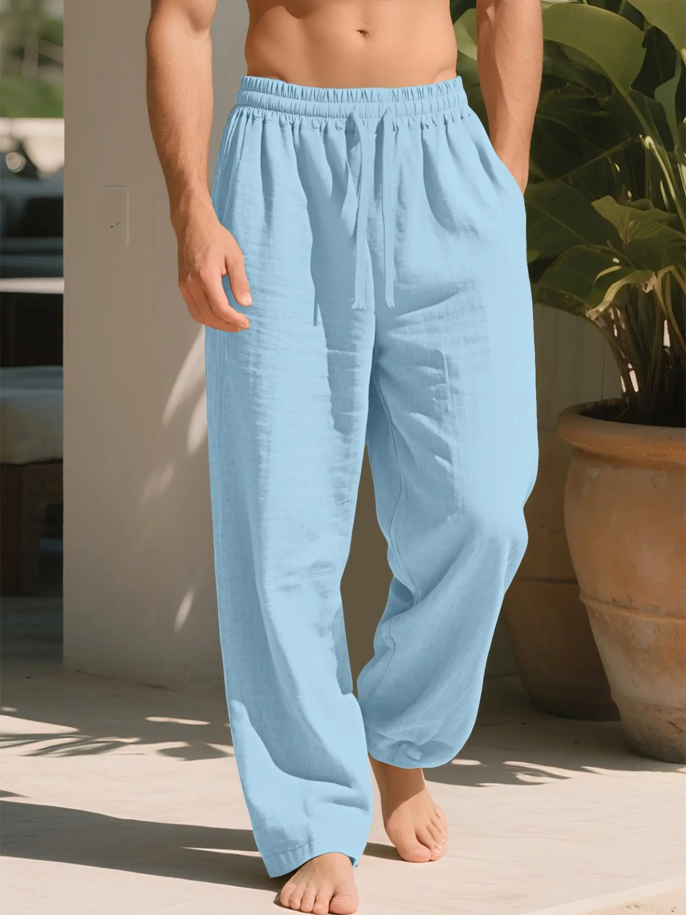 Men's linen pants boast a loose, straight - leg silhouette with an elastic waistband and drawstring. These solid - colored trousers exude an effortless, relaxed vibe, offering versatile styling for diverse scenarios.A year - round essential.