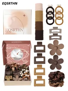 The 66pcs Morandi Brown Light Luxury hair accessory gift box includes flower clips, satin hair bands, pearl hair ties, and square hair clips. It comes with a self-adhesive mirror. The high-end low-saturation color scheme is versatile for daily commuting.