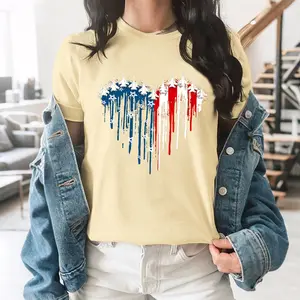 A Heart-Shaped Flag Pattern, Composed Of Multiple Fighter Jets Arranged In An Array, Using The Red, White And Blue Colors Of The American Flag With A Dripping Effect And Small Stars, A Casual T-Shirt.
