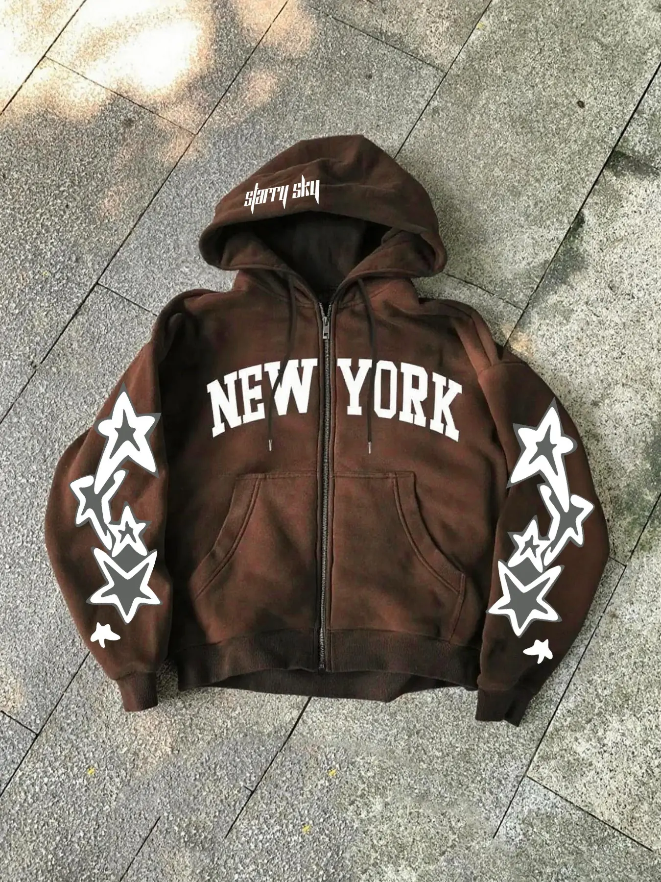 Unisex design, urban style, streetwear, Casual, avant-garde black zipper hoodie with fleece lining, featuring New York-themed lettering and star patterns. Graphic Hoodies Perfect for urban, Y2K, campus, hip-hop, fashion, trendsetting, and everyday wear.