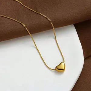 Gold-tone heart pendant necklace with an elegant design, perfect for parties or as a thoughtful gift.