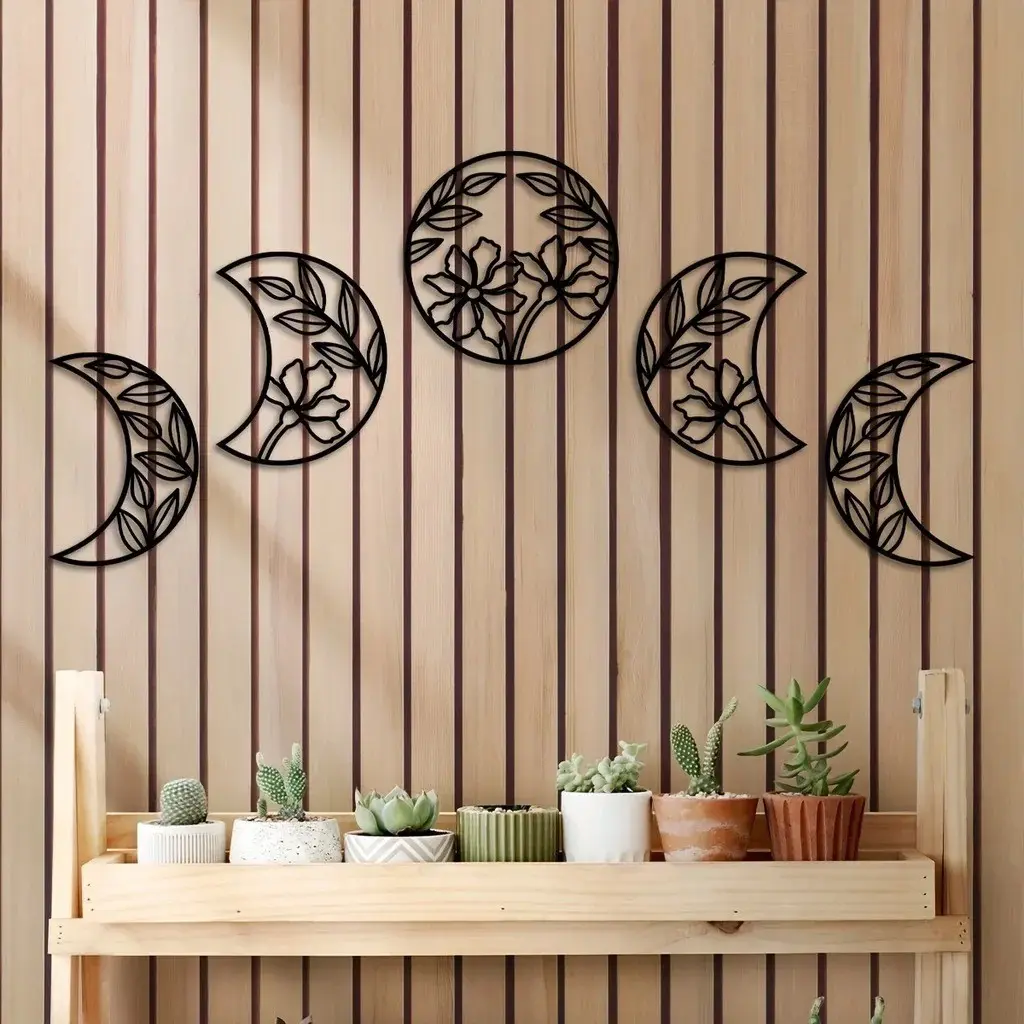 A set of 5 captivating metal moon phase wall hangings. Infused with floral leaf elements in Nordic style, they're ideal wall ornaments for a unique decor touch Celestial Decor. Decorative hanging ornaments
