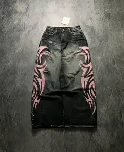 Vintage black jeans featuring a bold pink tribal flame print, distressed details and rips, high-waisted loose fit #Y2KJeans #LooseJeans #TribalFlamePrint #VintageJeans