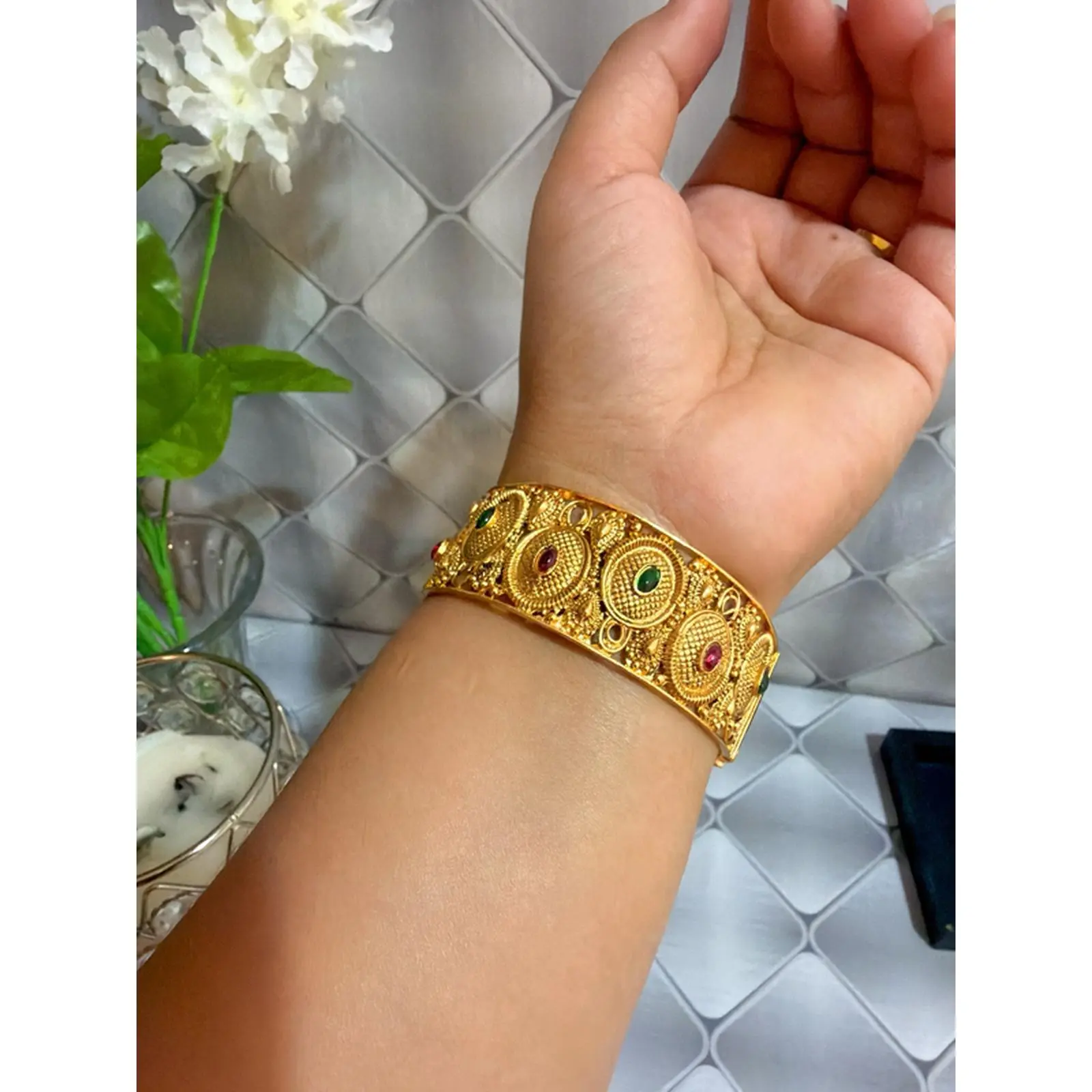 Brass Tone Openable Screw Bangle with Intricate Design and Embedded Stones
