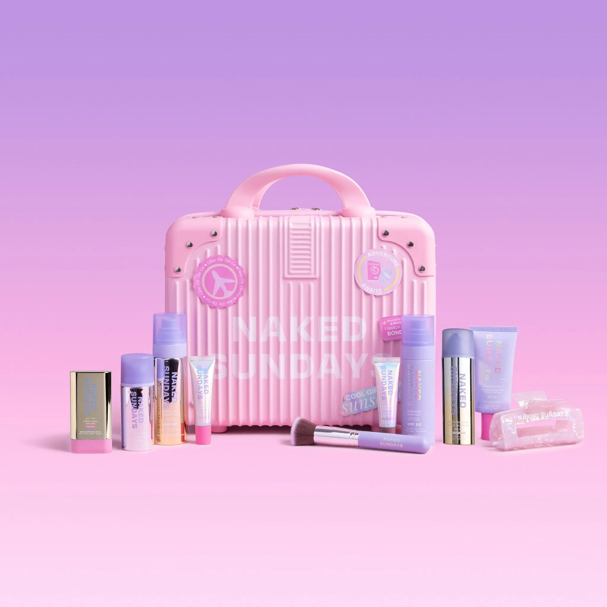 First Class Jetsetter Beauty Bundle Kit - Mini Exclusive Pink or Lilac Suitcase plus Naked Sundays bestselling SPF and Skincare products  (SAVE 40%)