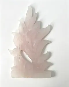 A carved piece in the shape of a nine-tailed fox made with pink Calcite .22cm