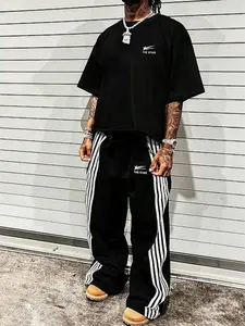 This men's two-piece Matching set includes a T-shirt and trousers, both decorated with letter and star patterns. Made from knitted fabric, it's suitable for everyday wear and all seasons.