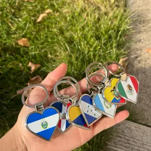 A Keychain with Heart-Shaped Design Featuring Your Country's Flag Colors and Logo
