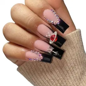 Elegant Black and Pink Nails with Rhinestones and Red Gemstone Design for a Chic Look