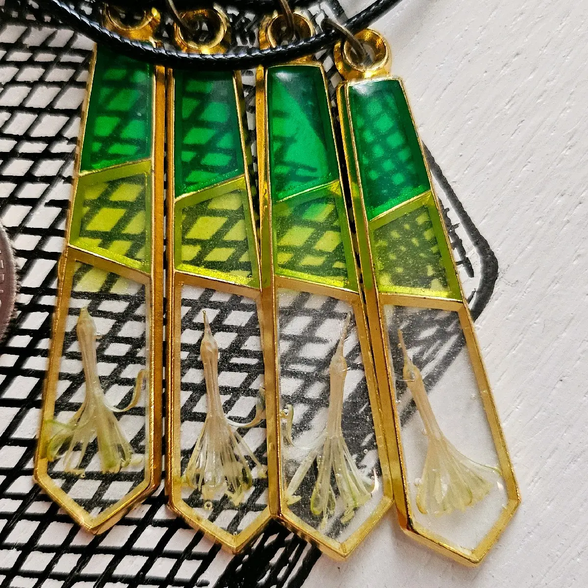 Resin necklace gem shape with Spotted Dracaena Flower