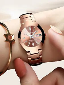 A ladies' watch with a rose gold-toned steel bracelet, exuding light luxury, elegance, and refined style. It features sparkling diamond accents, high-end aesthetics, and sleek lines, with a day-date quartz movement. Elegant Fashion Watch