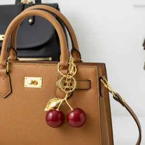 Cherry Themed Keychain and Bag Charms are cute accessories for handbags purses and car keys ideal for gifting to women and fashion lovers