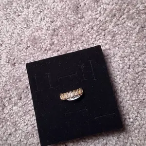 Rollie Elegant Gold-Tone Band Ring with Intricate Design for Everyday Wear