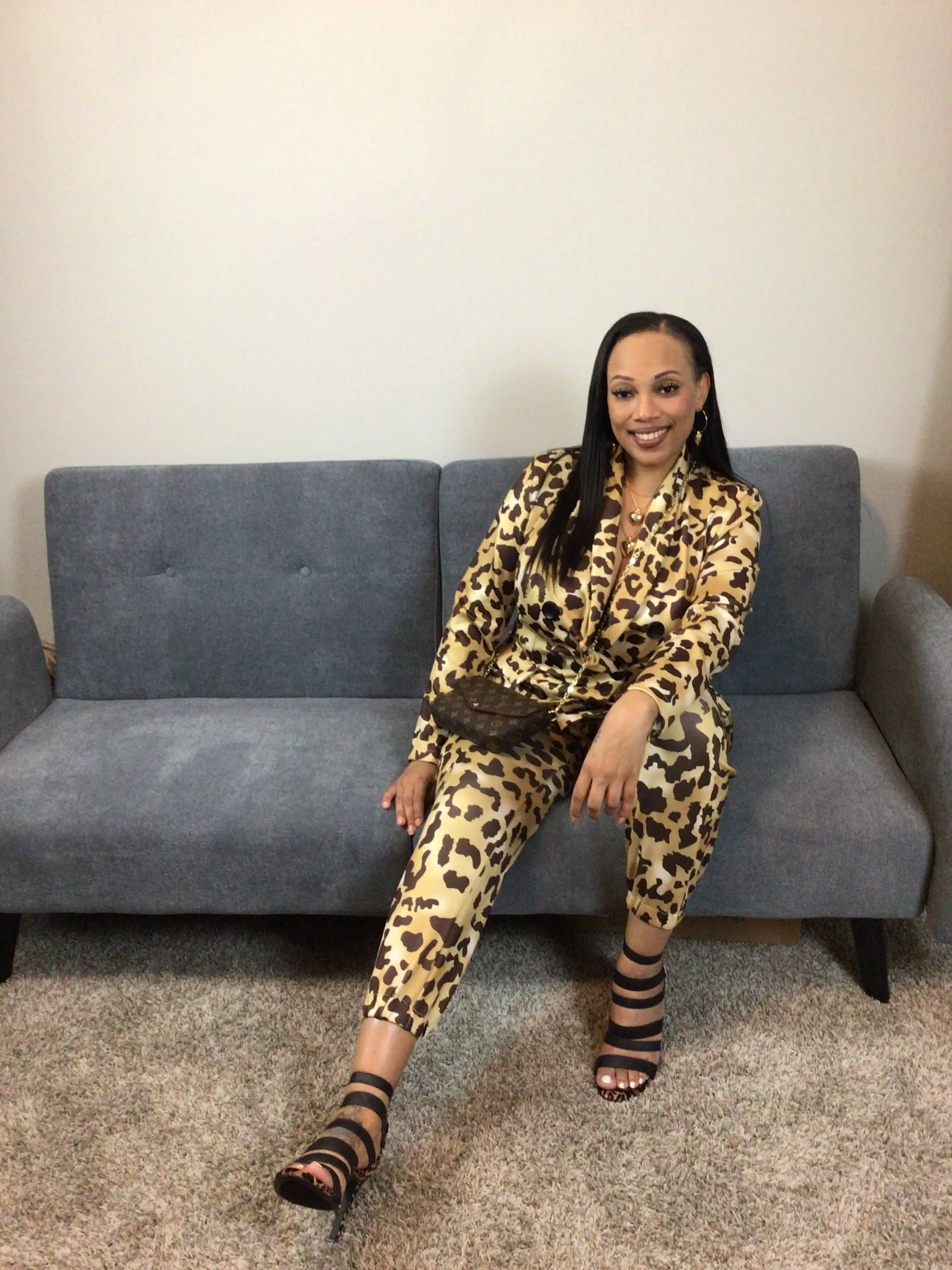 Women's double breasted two piece Cheetah Print  suit. Spandex/Polyester.