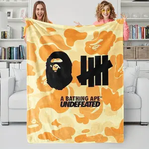 BAPE Undefeated Orange Camouflage Flannel Sofa Bed Blanket, Soft Plush with Ape Head Silhouette and Five Stripes, Indoor Outdoor Usage, Soft Cozy American Street Style Home Decor Gift for Fans