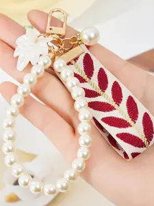 A fashionable and elegant pearl leaf striped ribbon bracelet keychain, Floral Pattern Keychain, Trendy Cute Keychain, Stylish Keychain, Keychain Jewelry, accessory, suitable for daily outfit matching, and also a surprising exquisite small gift.
