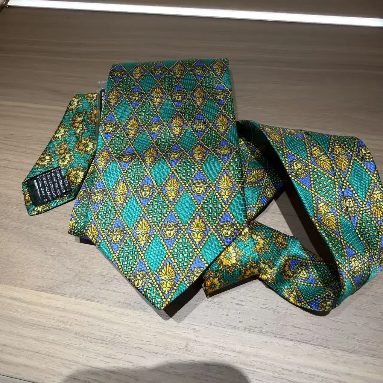 Pre-owned Versace Green Silk Medusa Pattern Tie with bag charm
