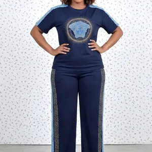 Elegant Women’s Two-Piece Top and Pants Set Comfortable Casual Chic Outfit with Short Sleeve Detail Flattering Everyday Wear Stylish Coordinated Suit for Spring and Beyond