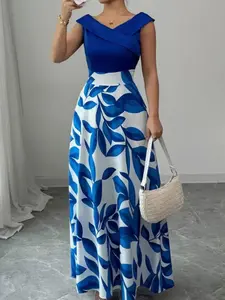 A sleeveless navy blue dress with blue and white leaf print panels and a V-neckline with a flared long skirt, suitable for Womenswear occasions such as dinners, upscale dates, art exhibitions, Evening that require a polished