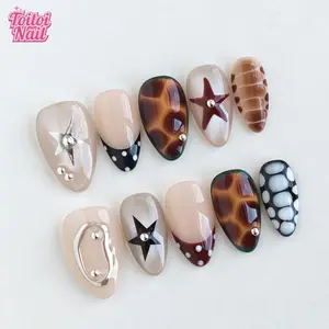 Tortoise Star Handmade Press-On Nails | Short Almond Shape, 10pcs | Edgy Y2K Tortoise Star Design | Sheer Nude Base & Amber Tortoise & Metal Star/Stud & Polka Dot Accents | Reusable DIY Nail Kit for Women | Trendy Nails for Spring, Summer, Parties
