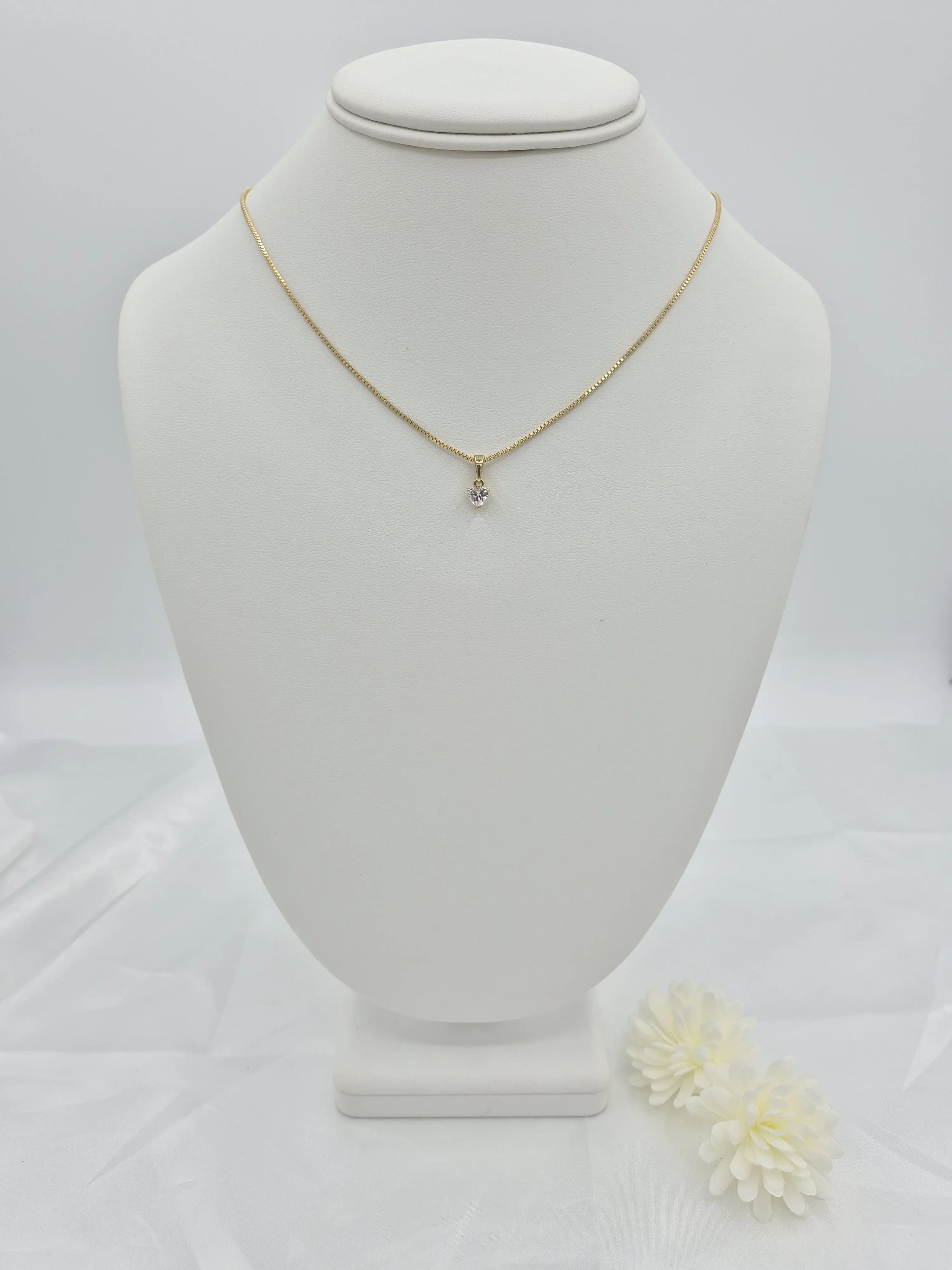 14k gold plated chain with a shiny minimalist pendant.(40)