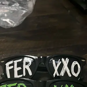 Feid feexxo black frame glasses w white vinyl