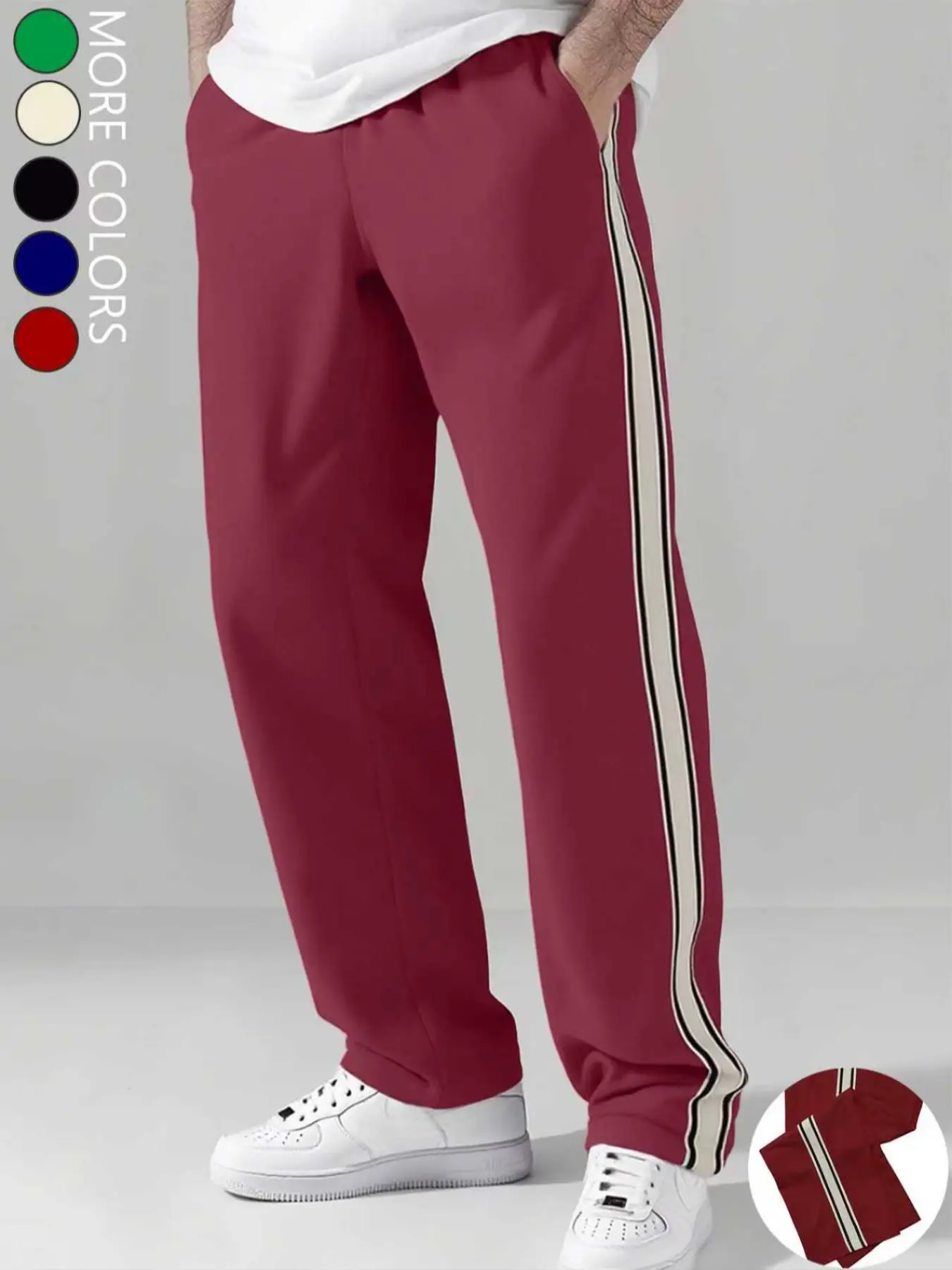 Men's straight-leg casual pants feature white stripe paneling on the sides and a drawstring waist. With a loose, comfortable casual style, they’re suitable for multiple occasions and work as year-round men’s trousers.
