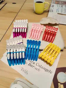 Hair clips, including alligator clips, seamless hair clips, duckbill clips, long-tipped clips, perming and dyeing clips, and bangs clips. Available in pink, red, blue, yellow, purple, and other colors (randomly shipped). A good gift for women.