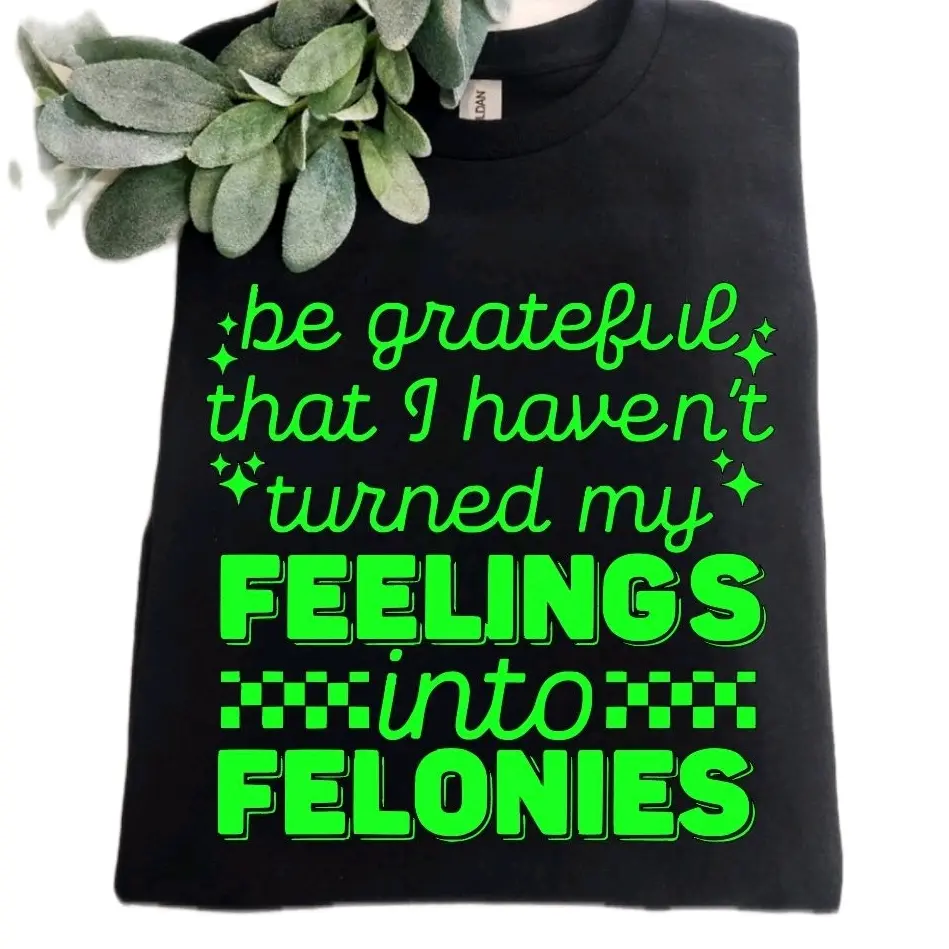 funny shirt turned my feelings into felonies sarcasm wavy letters retro graphic short sleeve black and lime green tshirt