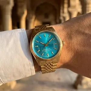 Time Machine Vintage Watch Bright Cyan Curved Textured Dial Gold 5-Link Band Minimalist Design Versatile Everyday Wear Unisex