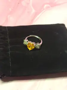Adjustable Cubic Zirconia Ring features a Yellow Heart at the Center