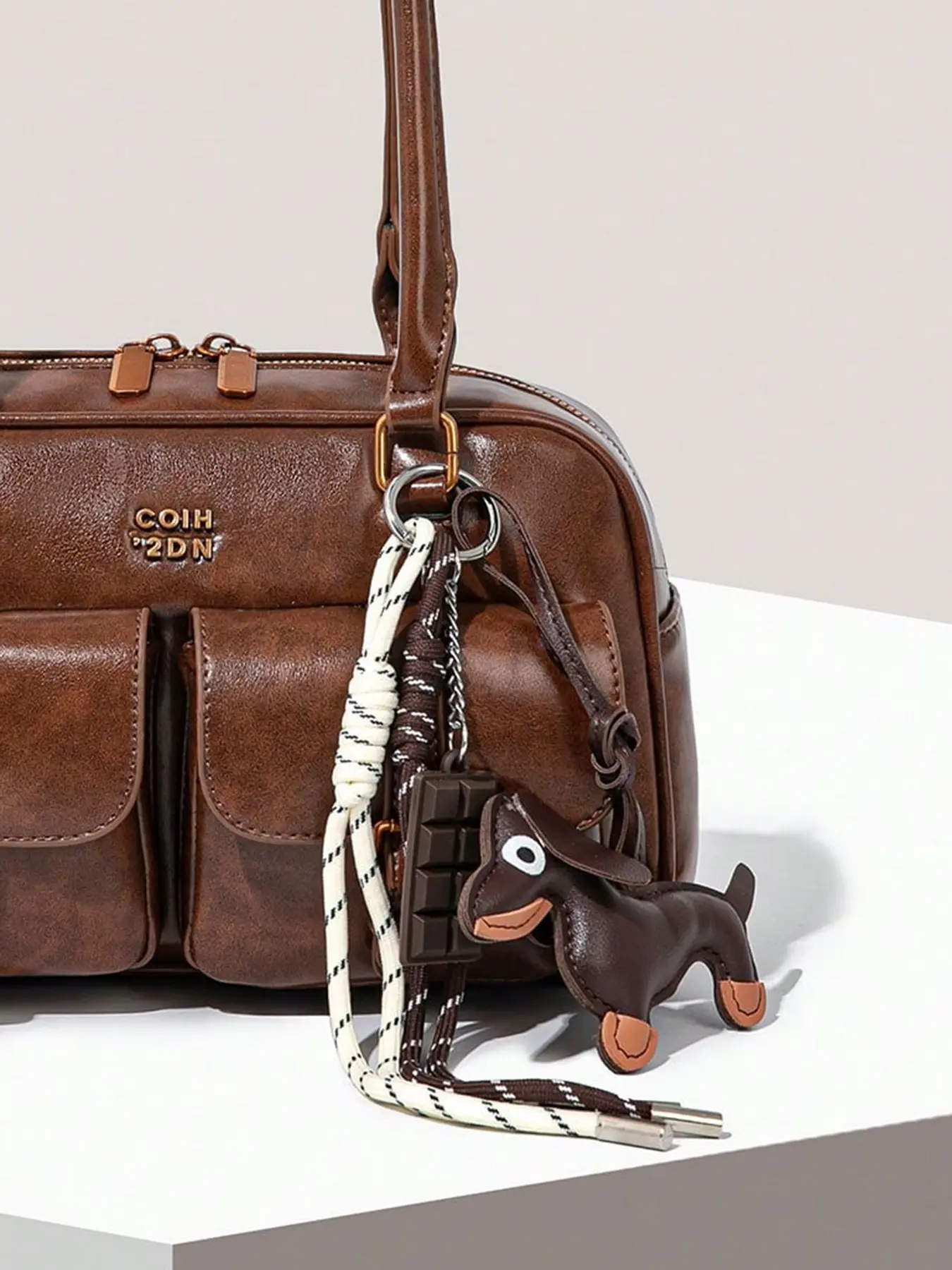 Exquisite and fashionable retro personalized sausage puppy pendant, suitable for bag hanging accessories, keychains, with woven hanging ropes and chocolate pendant elements, suitable for daily commuting and shopping wear, Purse Charm