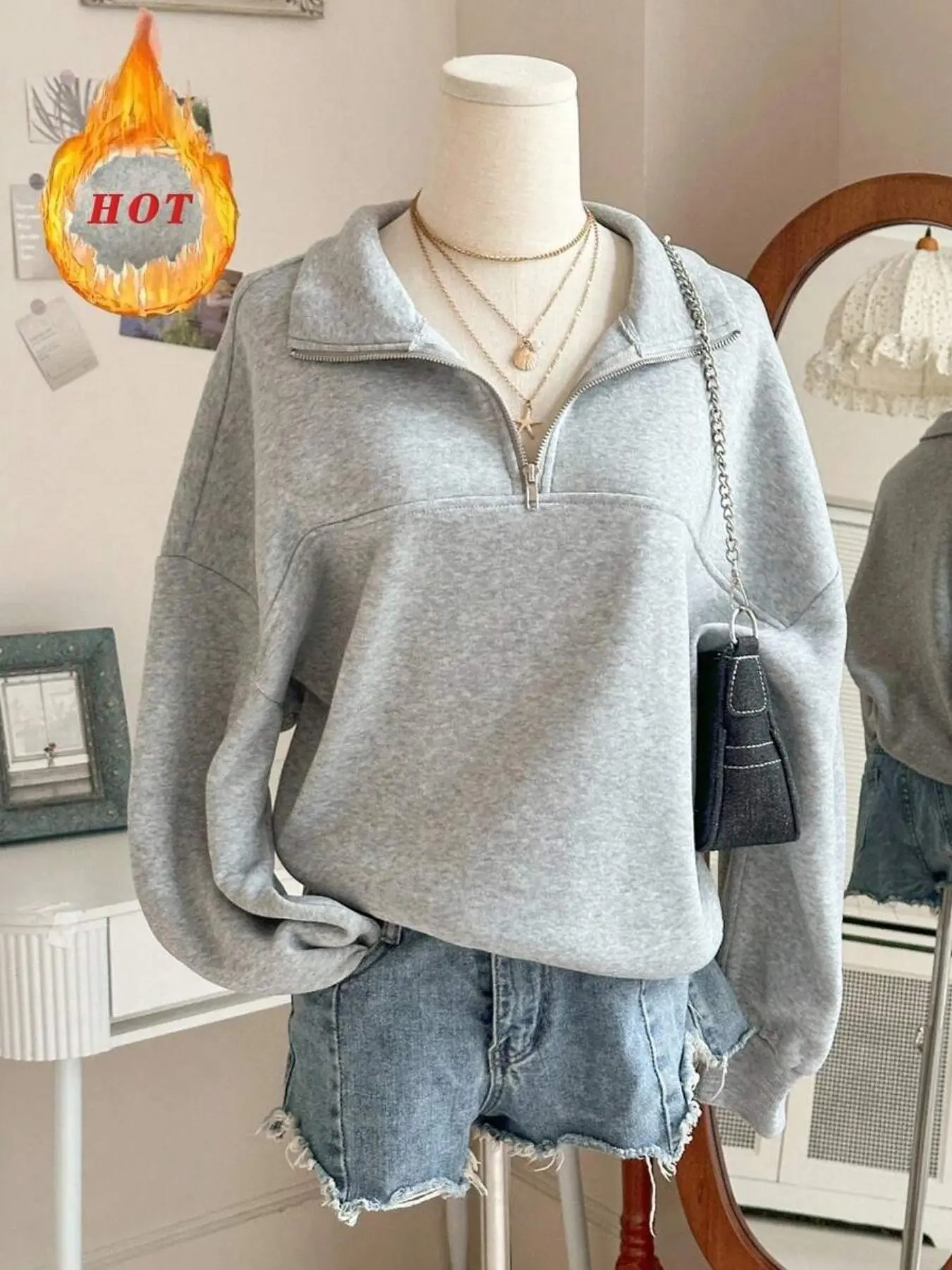 A solid-color zipper half-opening off-the-shoulder loose hoodie for women, a long-sleeved grey pullover sweatshirt for casual fashion daily wear in spring and autumn. It's the season for students to wear and return to school