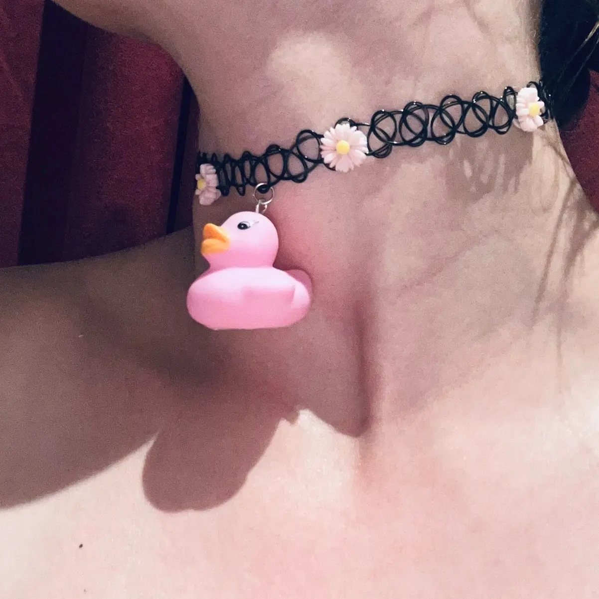 Tattoo choker with pink flowers and pink rubber duck pendant