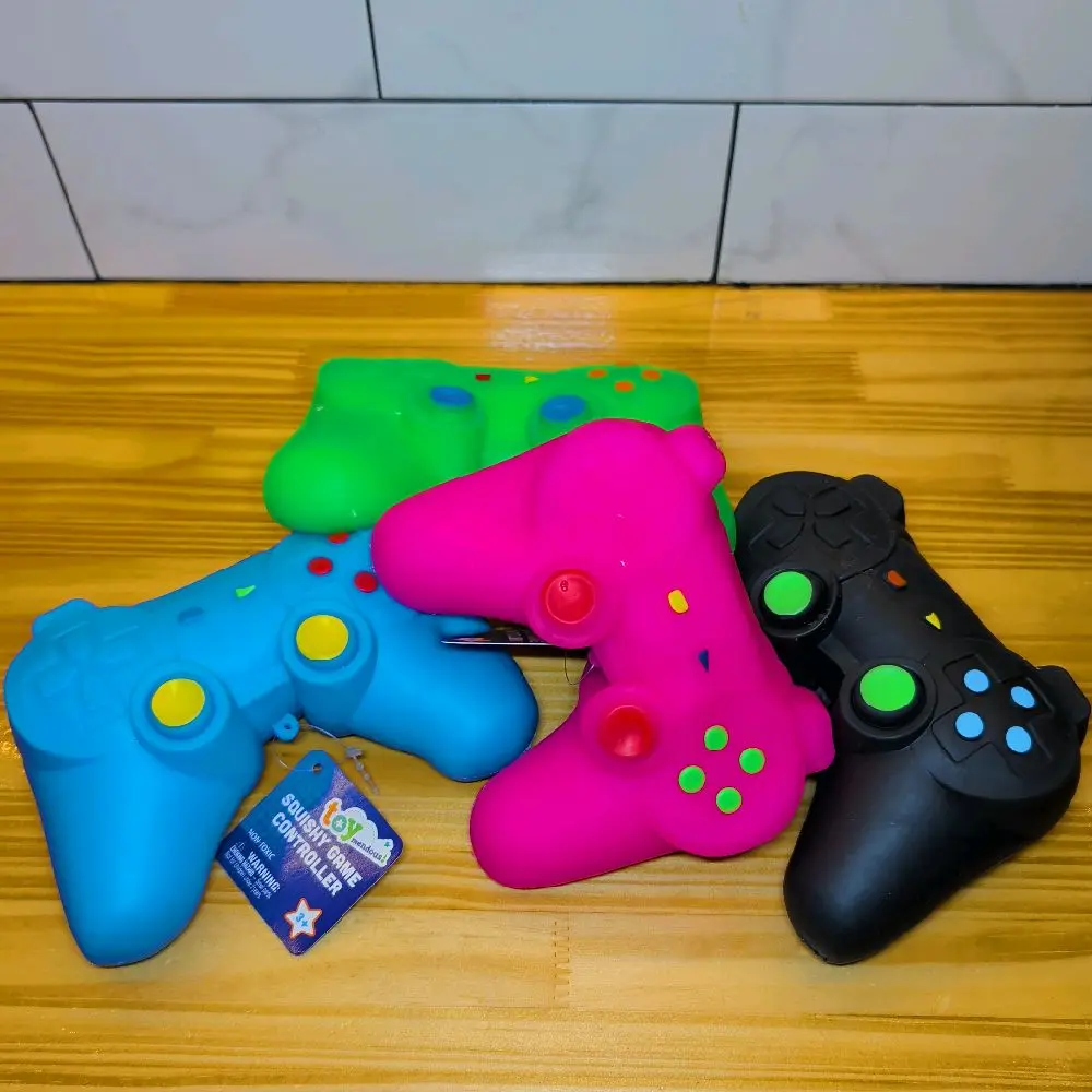 TOYMENDOUS!!  SQUISHY GAME CONTROLLER!!  AGES 3+ VARIOUS COLORS TO CHOOSE. GREAT FOR STRESS RELIEF!!