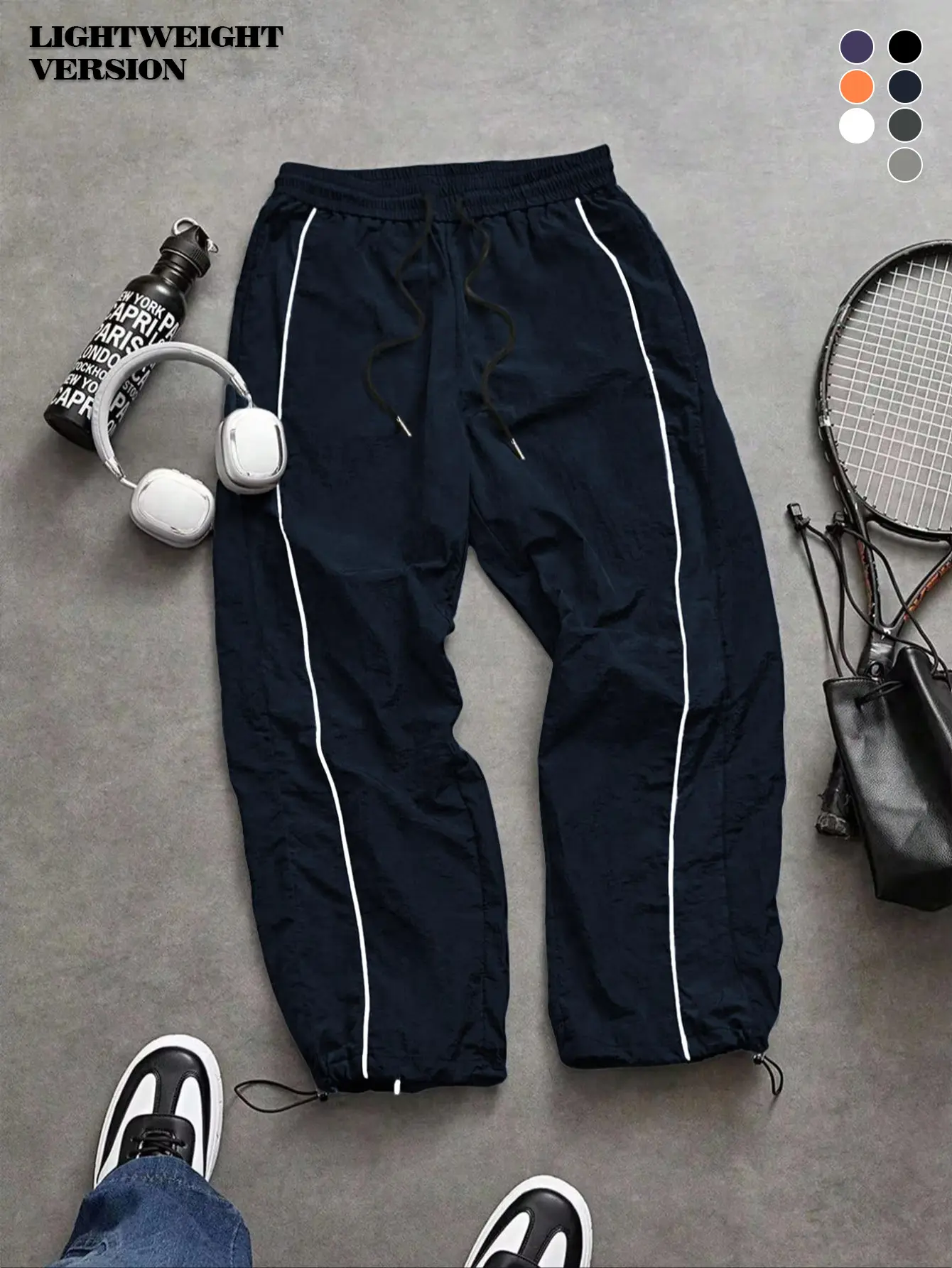 Men's lightweight casual fashion black sports pants with white stripes on the side, loose at the ankle, casual street style sports pants suitable for men and women couples, daily/street style, loose fit, windproof design