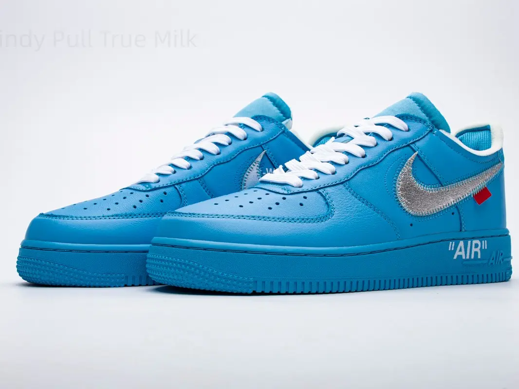 Solid bright sky blue patent leather low top skate sneakers, reflective silver raw-stitch side logo with tiny red tag, matching full blue shock-absorbing rubber sole, unisex vibrant trainers for summer festival, Y2K fits and street girl daily outfits