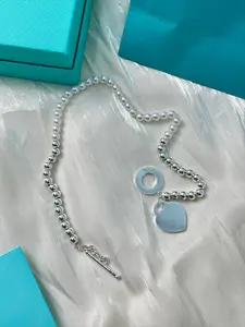 Heart Charm Pearl Double-Strand Bracelet — Elegant Half-Pearl Half-Silver Bead Chain with Trendy Toggle Clasp Design.