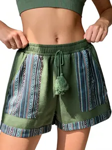 A pair of women's shorts with a drawstring waistband, Boho fringed decoration, striped and geometric pattern patchwork in dark green, suitable for summer, style, casual street style, and daily outing or beach play, Bohemian, Ethnic Pattern Shorts
