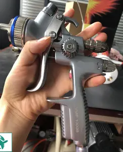 HVLP 1000B Spray Gun with a 1.3Mm Nozzle, Designed for Automotive Painting. This Low-Pressure Airbrush Comes with a 20.29oz Cup And Is Available in Silver