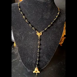 Raccoon vertebra onyx beaded rosary necklace
