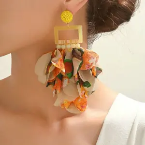 Make a statement with these stunning yellow floral print fabric tassel earrings! Lightweight, eye-catching, and full of charm, these exaggerated beauties add the perfect pop of color to any outfit.   Handmade design  Vibrant floral print  Bold, fashion